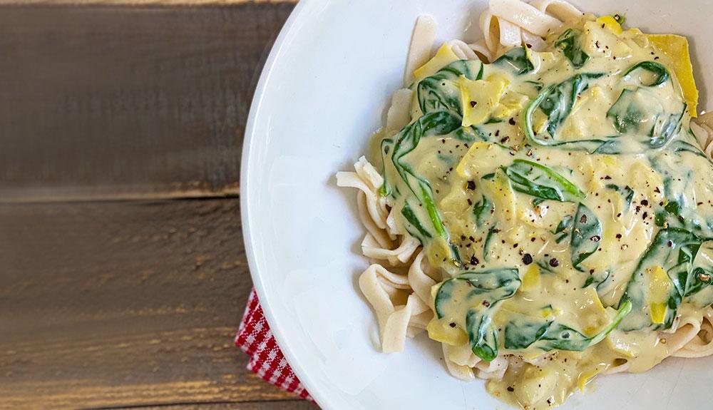 Plant Based Fettuccine with Spinach and Artichoke Hearts
